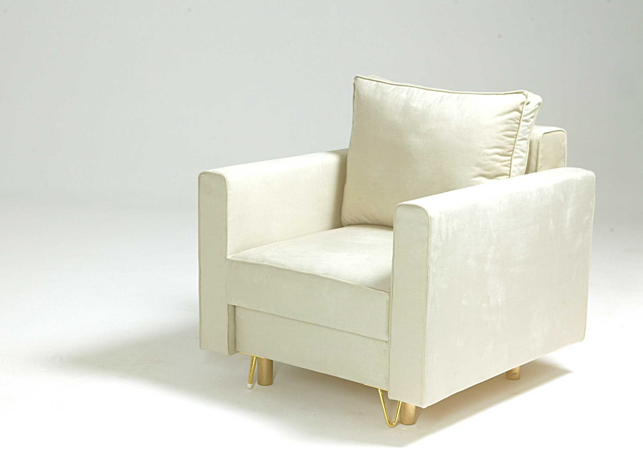 Beżowy fotel na złotych nogach DES